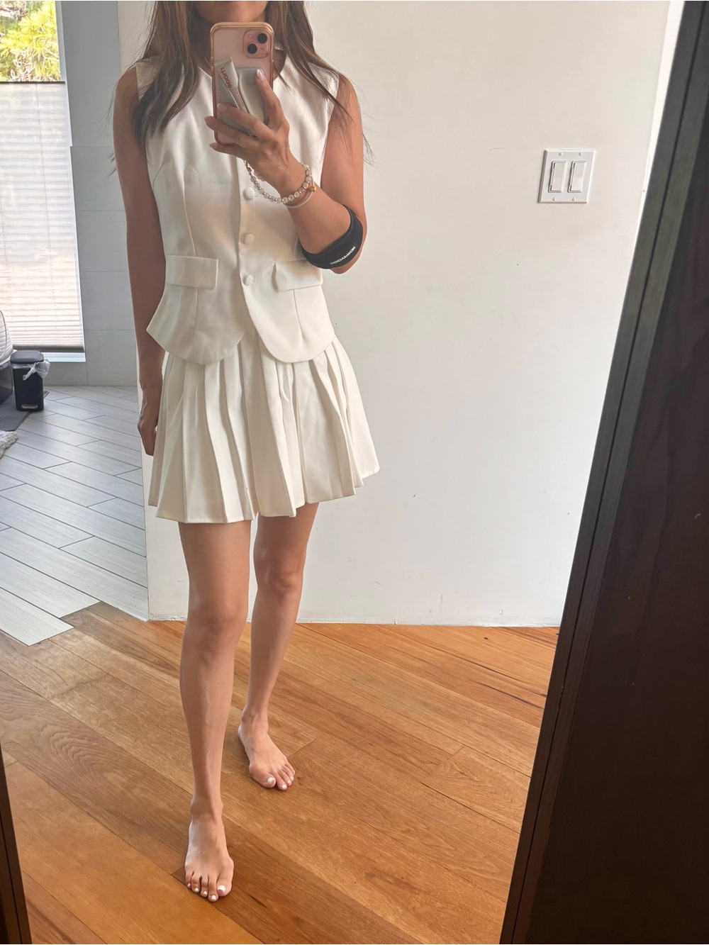 Sleeveless White Pleated Dress with Vest Overlay